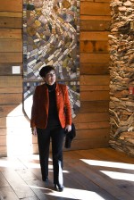 Image of Dame Patsy in front of an artwork