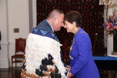 Dame Patsy greeting Mr Walter Walsh, of Gisborne, QSM for services to the community and broadcasting