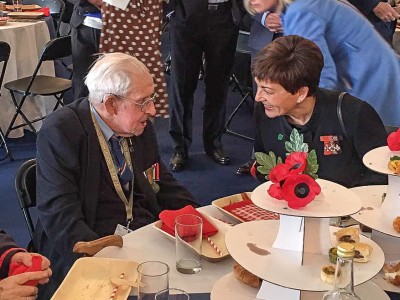 Image of Dame Patsy with a veteran at the veteran's lunch