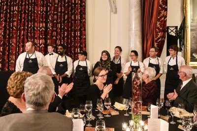 Image of the chefs being acknowledged by the guests