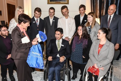 Image of Thomas Chin presenting Dame Patsy with a gift