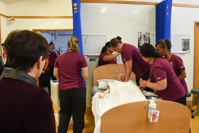 Image of nursing students showing what they've learned during their resuscitation training