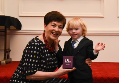 Dame Patsy received a candle from Eli Morton