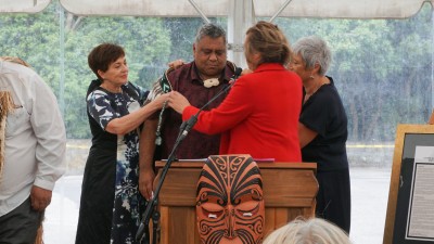 Image of the korowai being placed around the shoulders of Jason Kerehi, Chairperson, Rangitāne Tū Mai Rā Trust.