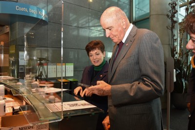 Dame Patsy and Sir David signing in as visitors 