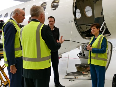 Dame Patsy Reddy and Sir David Gascoigne with the air ambulance