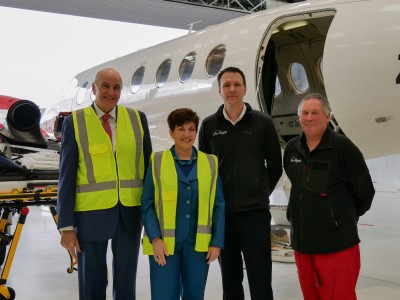 Dame Patsy Reddy and Sir David Gascoigne with the Life Flight air ambulance