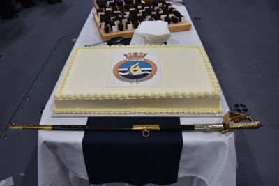 Image of a cake decorated with HMNZS Aotearoa's badge