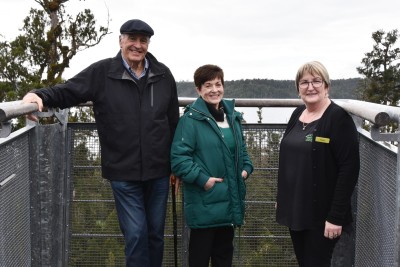 Image of Dame Patsy and Sir David with West Coast Treetop Walkway manager Vonnie Cherry