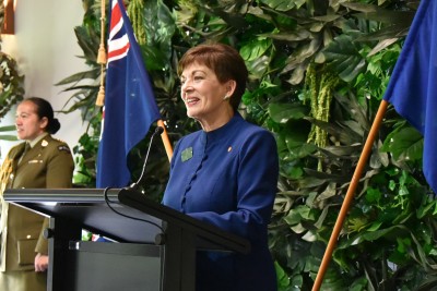 Dame Patsy Reddy speaking at a lectern