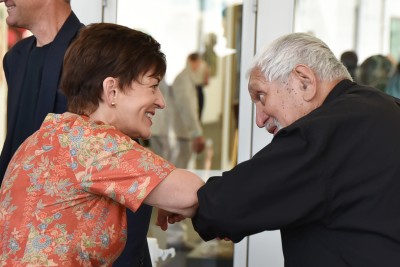 Image of Dame Patsy bumping elbows with Ngāti Whātua Ōrākei elder Fred Watene