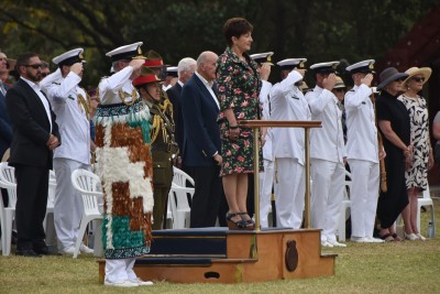Dame Patsy Reddy on a podium observing the Guard