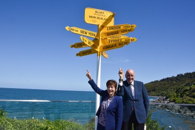 Dame Patsy and Sir David with Bluff's international signposts