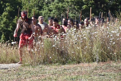 Image of warriors arriving down from Ruapekapeka Pā for the powhiri