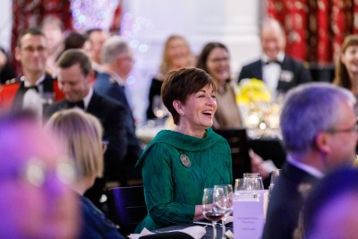 Dame Patsy Reddy at a table 