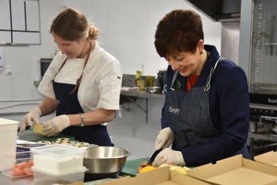 Dame Patsy Reddy and Michelle Hartley making salsa