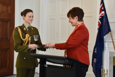 Aide de Camp handing letters of credence to Dame Patsy
