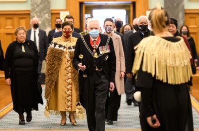 Herald of Arms Extraordinary Phillip O'Shea leads the Official Party into Parliament's Legislative Council Chamber