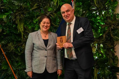 Dame Cindy presenting a commemorative plaque to Mr Peter Johnson, Board Chair of NZRDA