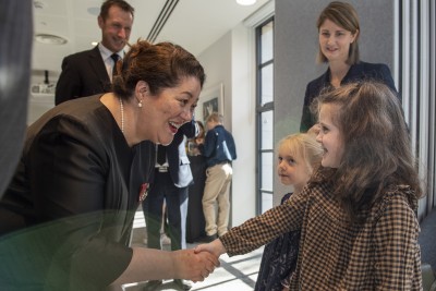 Dame Cindy meets two children at New Zealand House
