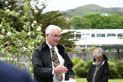 Dr Davies in the garden giving a speech