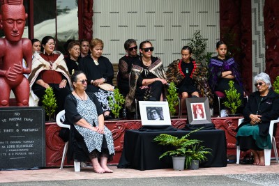 Portraits of Titewhai Harawira and Her Late Majesty on display at the front of Te Whare Rūnanga