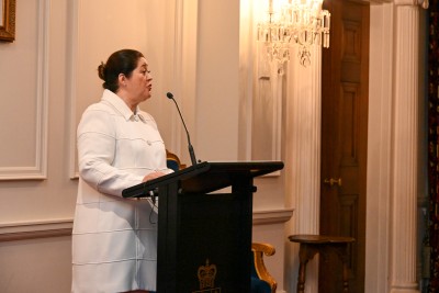 Dame Cindy speaks at a lectern