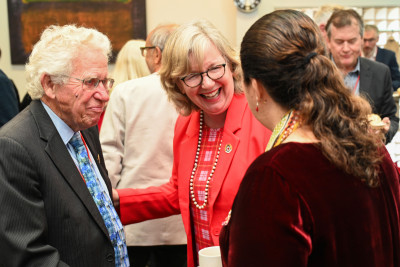 Dame Cindy being introduced to one of the attendees