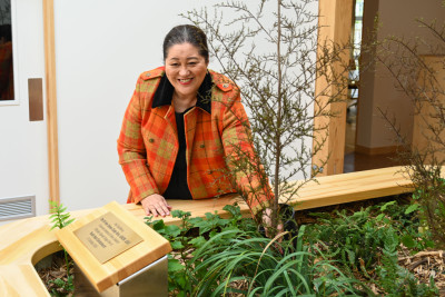 Dame Cindy planting a kahikatea tree