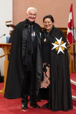 Dame Cindy presents Dr Davies with his Commander of the Order of St John