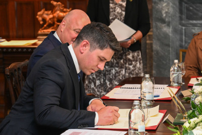 Mr Meager signing his affirmation documents
