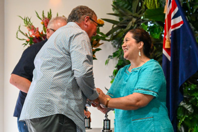 Dame Cindy congratulating Advocacy Award recipient John Ellwood