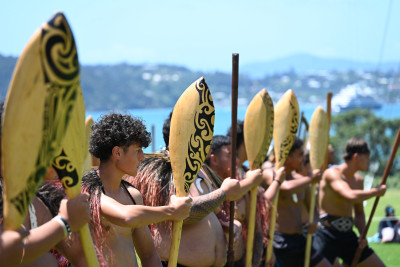 Waka crew performing at the Waitangi powhiri for Dame Cindy