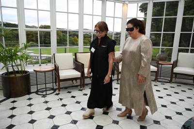 Kate Kerr guiding Dame Cindy, who is wearing glasses impairing her vision