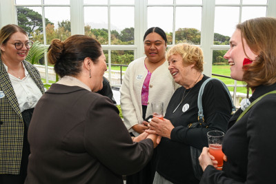 Dame Cindy meeting a guest at the reception