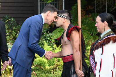 HE Mr Daniel Sloper is greeted with a hongi