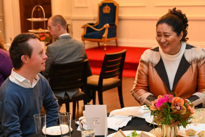 Dame Cindy with one of the guests for the celebratory high tea