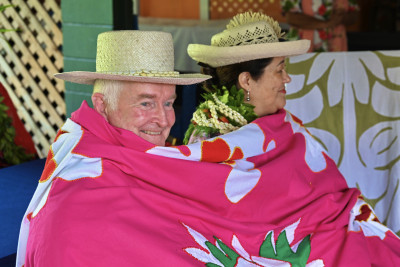 Dame Cindy and Dr Davies wrapped in a traditional embroidered quilt