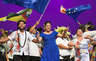 Performance with Cook Islands flags flying