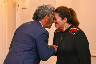 Dame Cindy congratulating Dr Reuben Collier