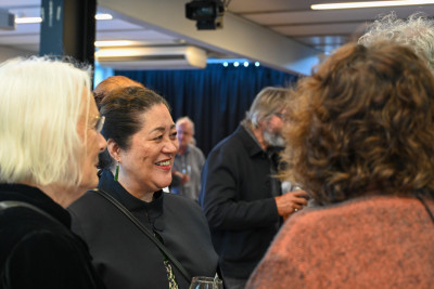Dame Cindy speaking with guests