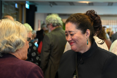 Dame Cindy speaking with guests