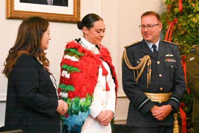 Dame Cindy and Air Marshall Tony Davies congratulating NZDF Person of the Year, Acting Petty Officer Kristen Kotuhi