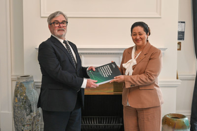 Dame Cindy receiving the report from Grant Illingworth, KC, Chair