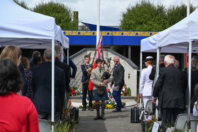 An Ōtaki College piper leads the official party