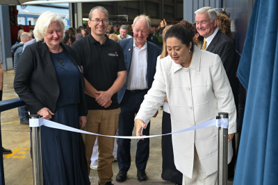Dame Cindy cuts the ribbon to open The Blue House
