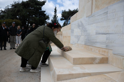 Dame Cindy paying her respects at the No. 2 Outpost Cemetery memorial