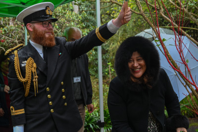 LT Andrew Chisholm with Dame Cindy as she plants her tree in the rain