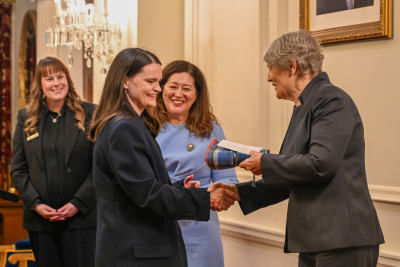 Dame Cindy and Helen Clark present Lucy Hayes-Stevenson with a gift
