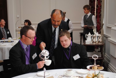 The Governor-General pours a cup of tea for Edward Borkin and Thomas Sadgrove.